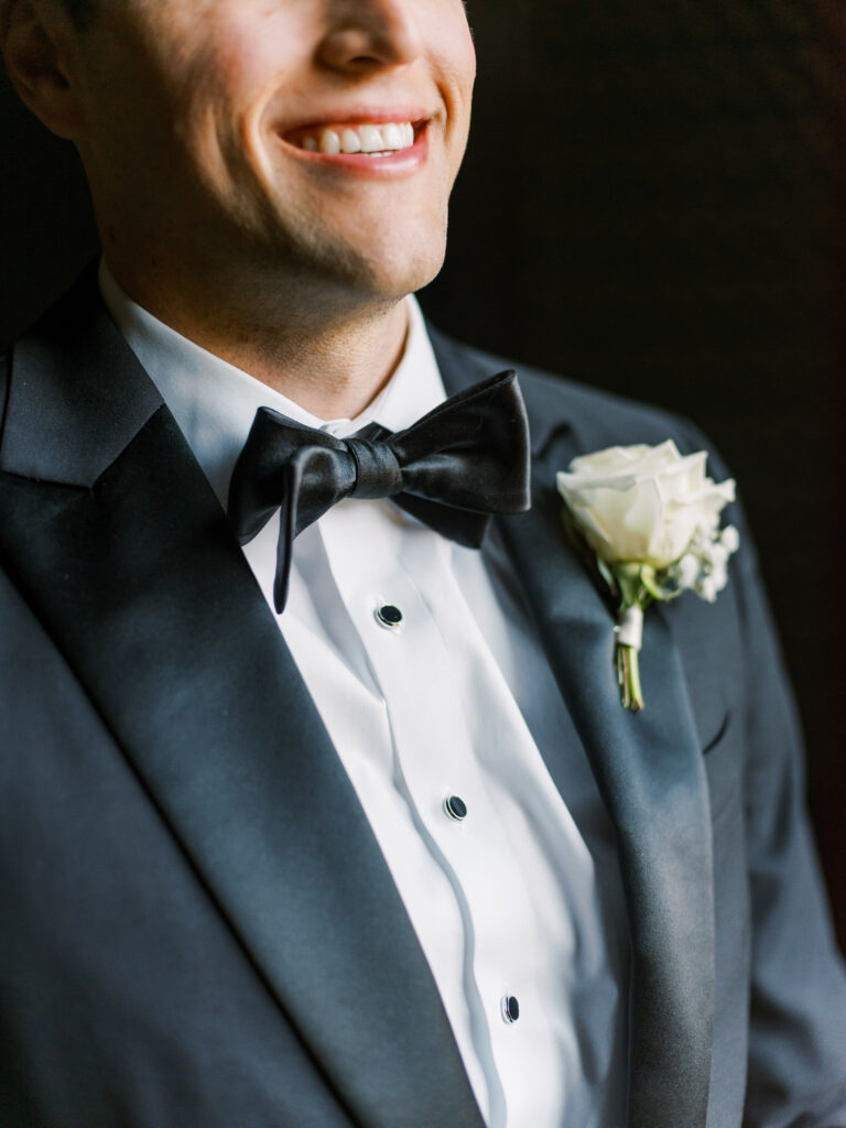 Detail photo of groom's tie and boutonniere, photographed by Dallas Wedding Photographer, Bethany Erin Photography.