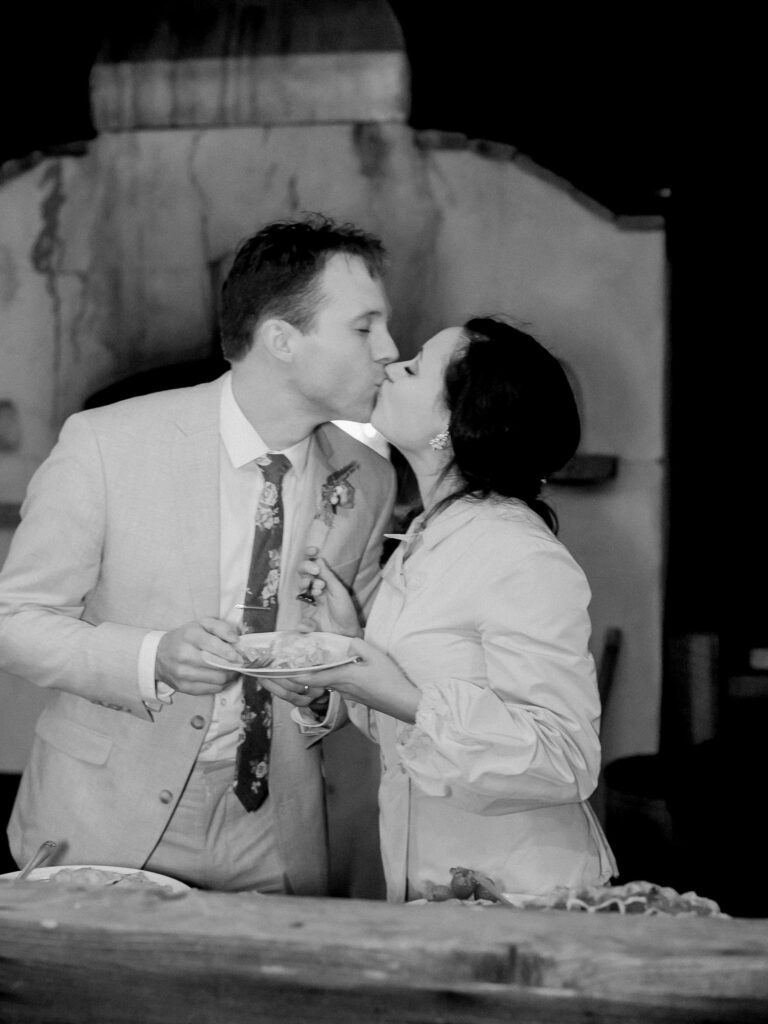 Bride and groom cake cutting at outdoor wedding reception at Greenwood Community Center, in Elk, California, photographed by destination wedding photographer, Bethany Erin Photography.