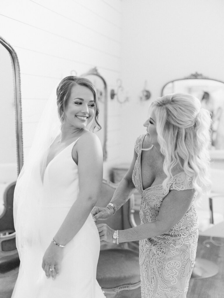Bride getting ready with mother, photographed by Dallas Wedding Photographer, Bethany Erin Photography. 