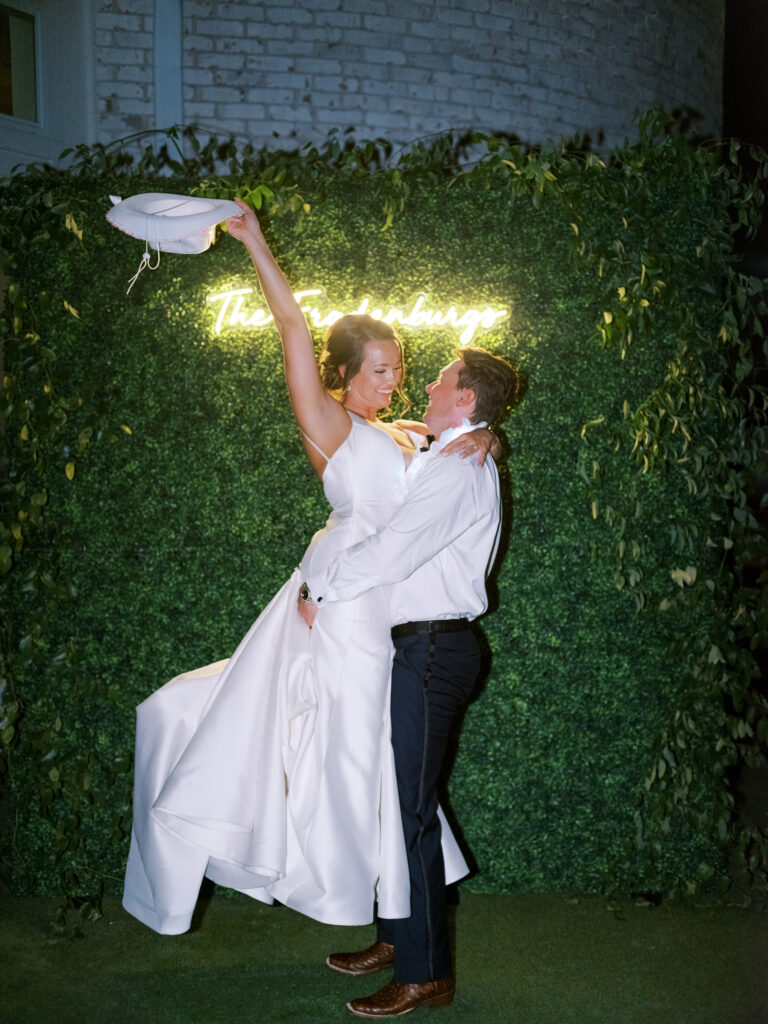 Bride and groom celebrating, photographed by Dallas Wedding Photographer, Bethany Erin Photography. 