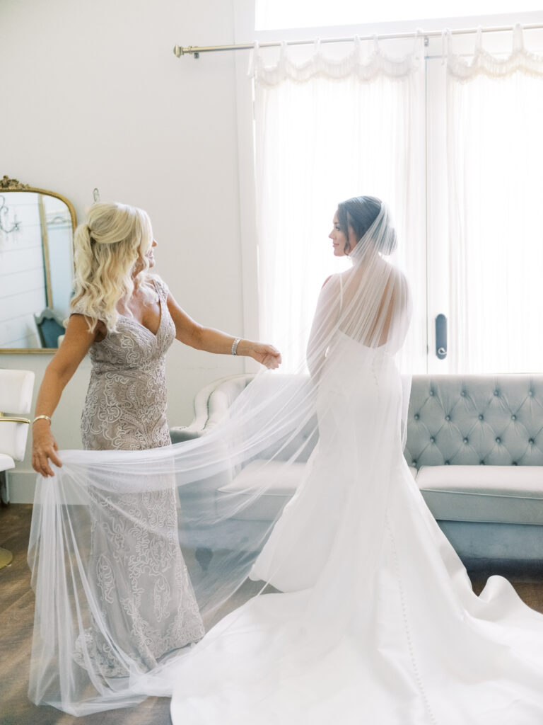 Bride and mother with veil, photographed by Dallas Wedding Photographer, Bethany Erin Photography. 
