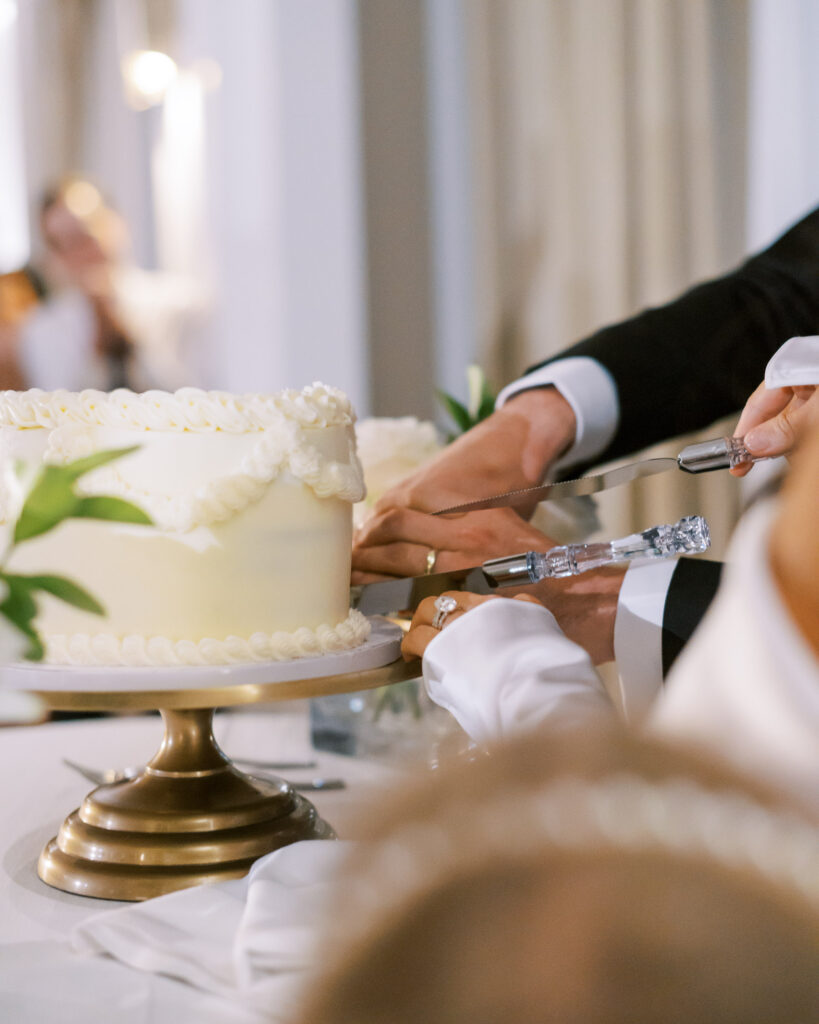 Bride & groom surprise baby gender reveal wedding cake cutting at Hotel Swexan, photographed by Dallas Wedding Photographer, Bethany Erin Photography.