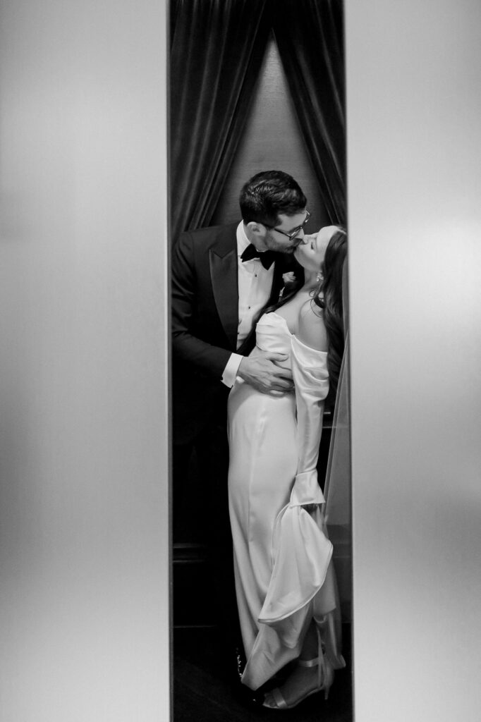 Bride & groom kissing in elevator at Hotel Swexan, photographed by Dallas Wedding Photographer, Bethany Erin Photography.