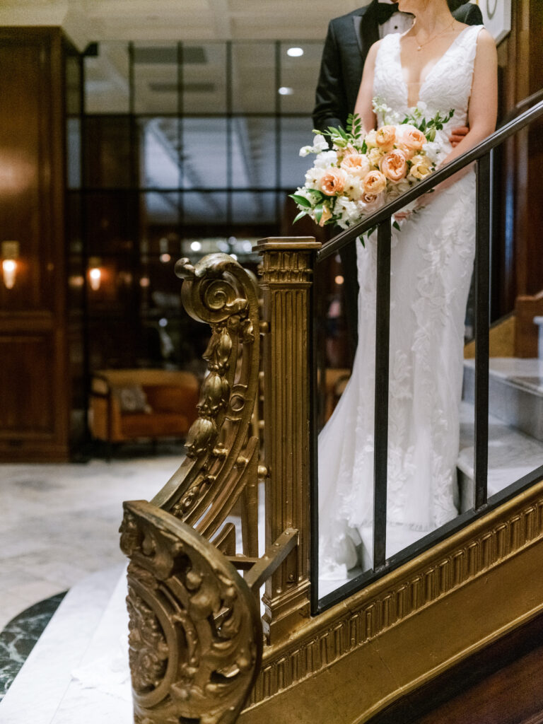 Bride and groom on staircase at The Adolphus Hotel, photographed by Dallas Wedding Photographer, Bethany Erin Photography.