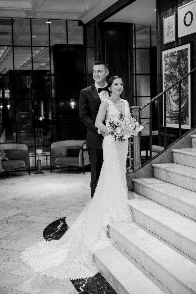 Bride and groom on staircase at The Adolphus Hotel, photographed by Dallas Wedding Photographer, Bethany Erin Photography.