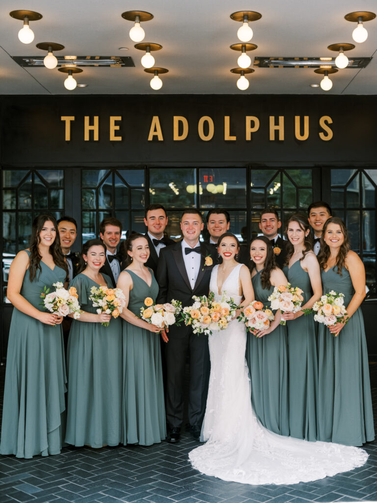 Bride and groom with wedding party at The Adolphus Hotel, photographed by Dallas Wedding Photographer, Bethany Erin Photography.